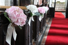 Amazing hydrangea heads as pew ends